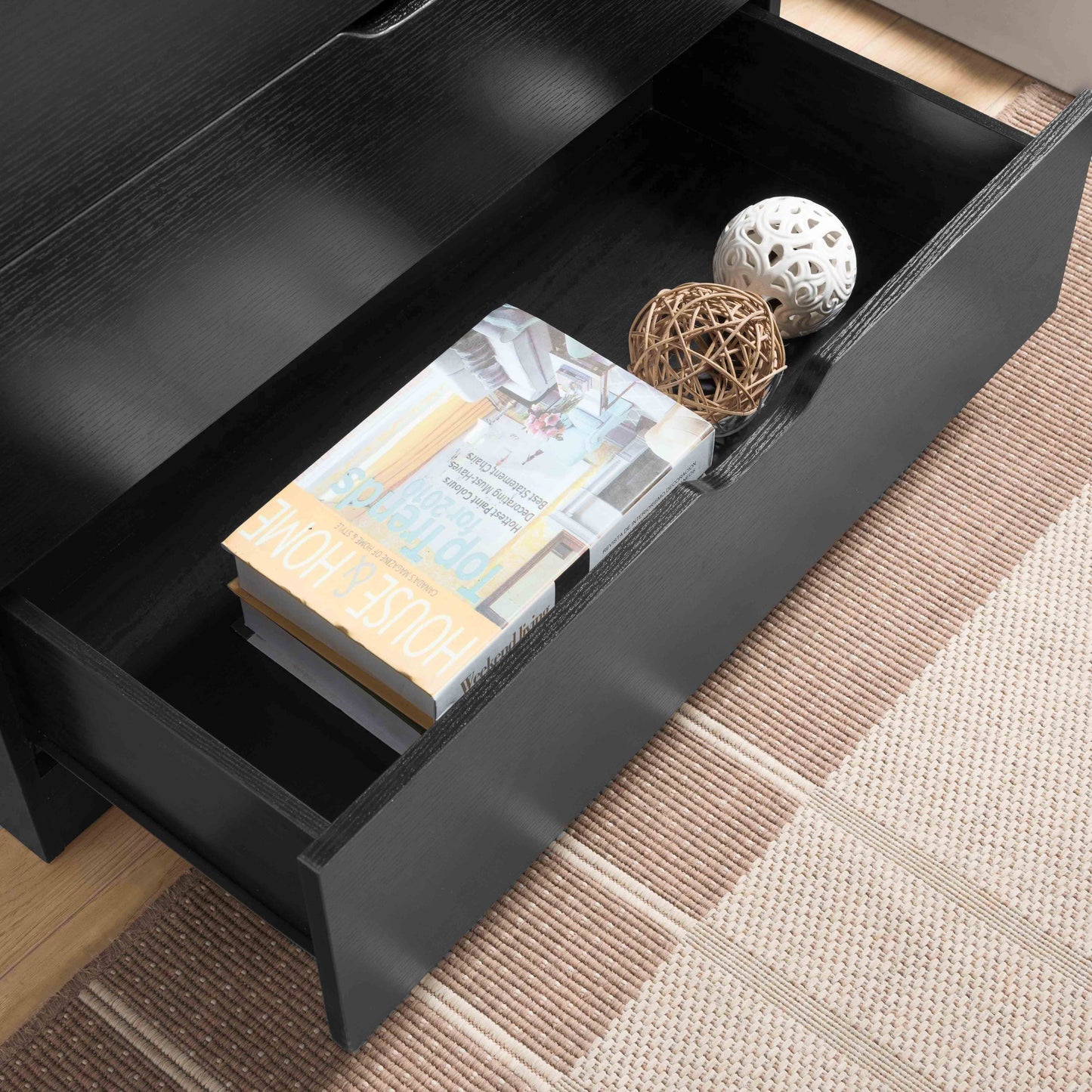 Modern black dresser with five drawers and metal glides for clothes and storage