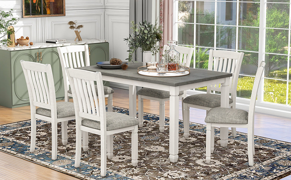 7-piece dining set with upholstered chairs and shaped legs, gray table, white chairs