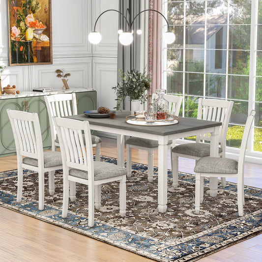 7-piece dining set with upholstered chairs and shaped legs, gray table, white chairs